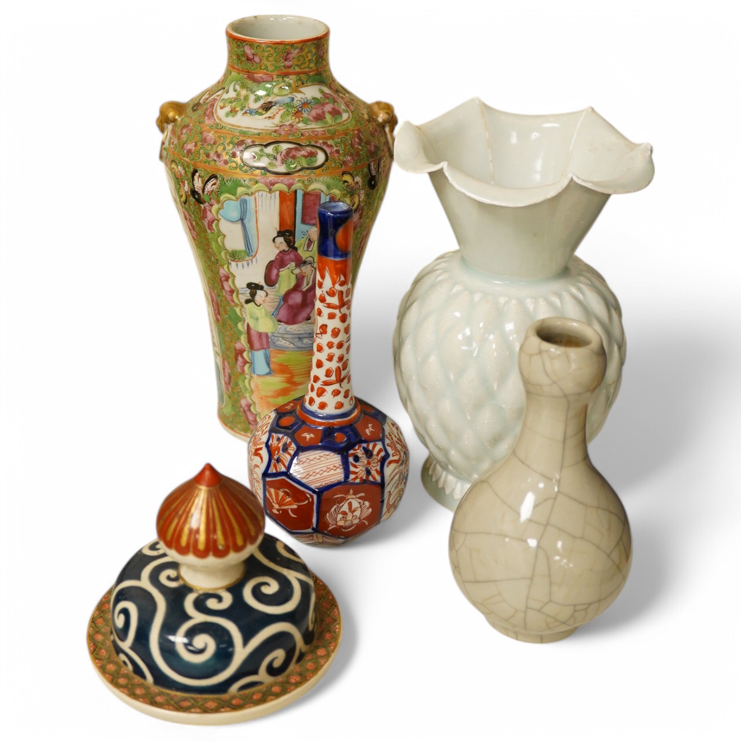 A Chinese Canton pattern vase, crackle glazed bottle vase, pale green vase, a Japanese Imari bottle vase and another cover, famille rose vase 24cm high. Condition - poor to good